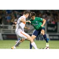 Orange County SC Midfielder Mats Bjurman Battles for the Ball