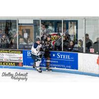 Janesville Jets Forward Brenden MacLaren against the Boards