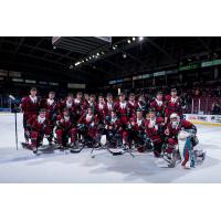 Kelowna Rockets pose in their Don Cherry uniforms