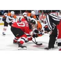 Phil Varone of the Lehigh Valley Phantoms (26) faces off with the Binghamton Devils