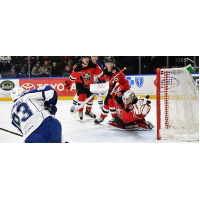 Binghamton Devils goaltender Mackenzie Blackwood dives to stop a Syracuse Crunch shot