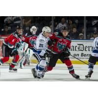 Kelowna Rockets LW Nolan Foote (right) holds off the Victoria Royals