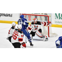 Binghamton Devils goaltender Cory Schneider turns aside the Syracuse Crunch attack