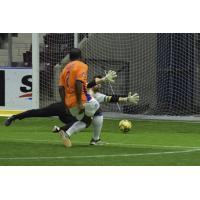 Baltimore Blast goalkeeper William Vanzela dives to stop a Mississauga Metrostars' shot