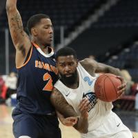 Halifax Hurricanes guard Terry Thomas drives against the Island Storm
