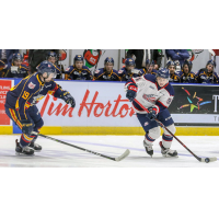 Saginaw Spirit left wing Cole Perfetti (right) against the Barrie Colts