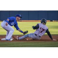 Omar Estevez of the Tulsa Drillers tags out a runner trying to steal second in a 6-4 loss to Arkansas