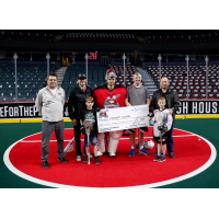 Roughnecks and Ascent Consulting Ltd. Direct present check for $14,180 to KidSport Calgary