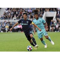LAFC's Carlos Vela (L) and Seattle's Roman Torres (R)