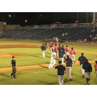 Pensacola Blue Wahoos rush the field after winning Game Four