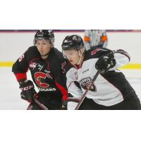 Vancouver Giants right wing Justin Lies (right) vs. the Prince George Cougars