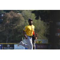 Nick Akins of the Vallejo Admirals takes a glance at the camera on his way back to the dugout