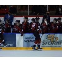 Vancouver Giants right wing Jaden Lipinski gets congratulations from the bench vs. the Kamloops Blazers